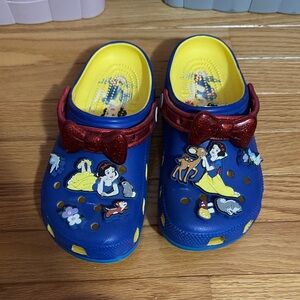 Disney women’s Blue and Yellow Slippers with Red Accents